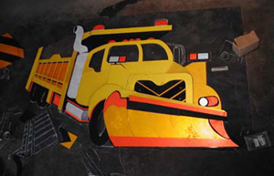 This is the completed truck before it is attached together with bolts and rivets, still sitting on the tra paper template.