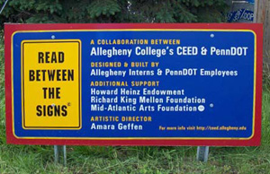 Read between the signs informational plaque which indicates that this is a collaborative project between allegheny college and PennDOT.  Additional Support was offered by the Howard Heinz Endowment, Richard King Mellon Foundation, and Mid-Atlantic Arts Foundation.