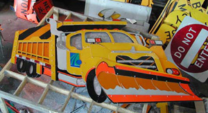 The final completed Snowplow displayed on the table, ready to be placed on the fence during the next summer internship.