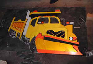 The truck body is mostly laid out on the tar paper with the exception of the silver highlights and the under carrage.