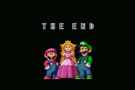 The final ending screen of Super Mario World where mario and luigi are standing with the princess in the middle.  The text, 'the end' is displayed underneath the group.